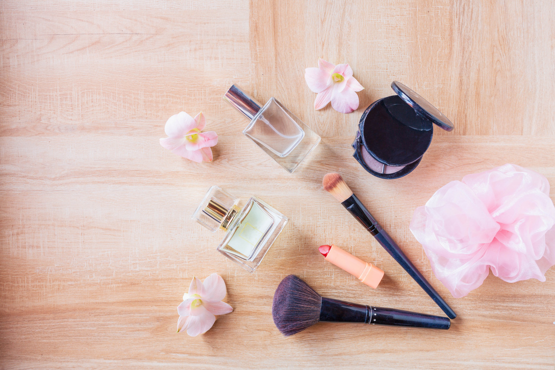 Perfume  and Makeup Cosmetics on Wooden  Background